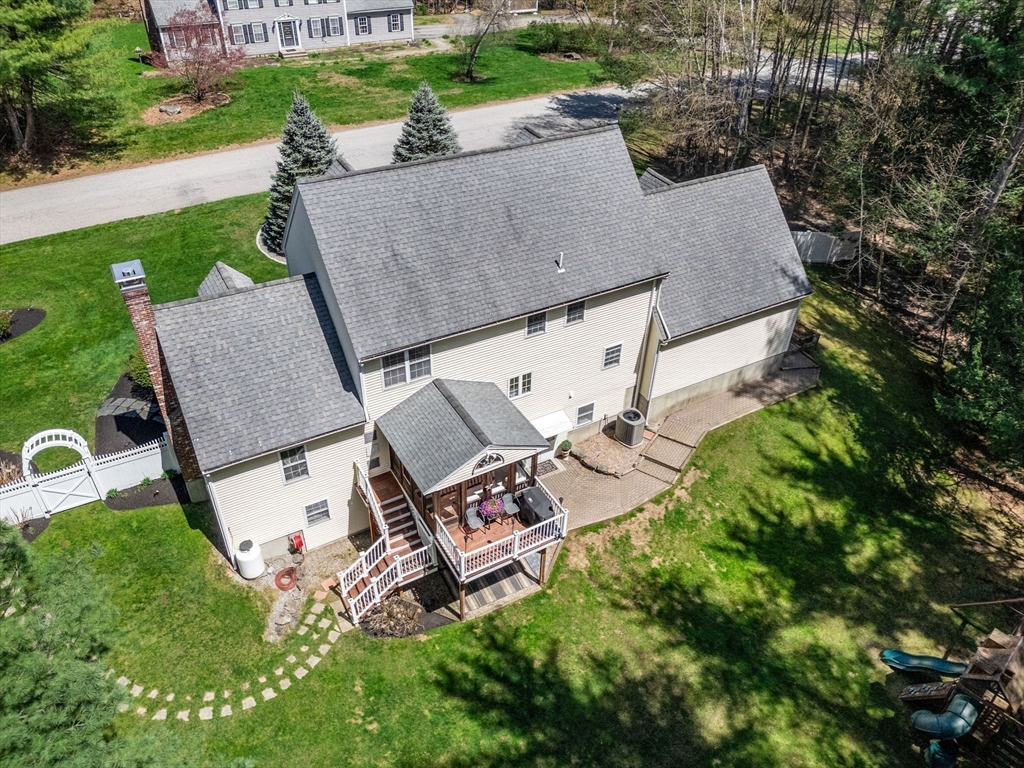 19 Powhatan Road Pepperell, MA 01463 - Photo 34 of 38 an aerial view of a house with garden space and street view