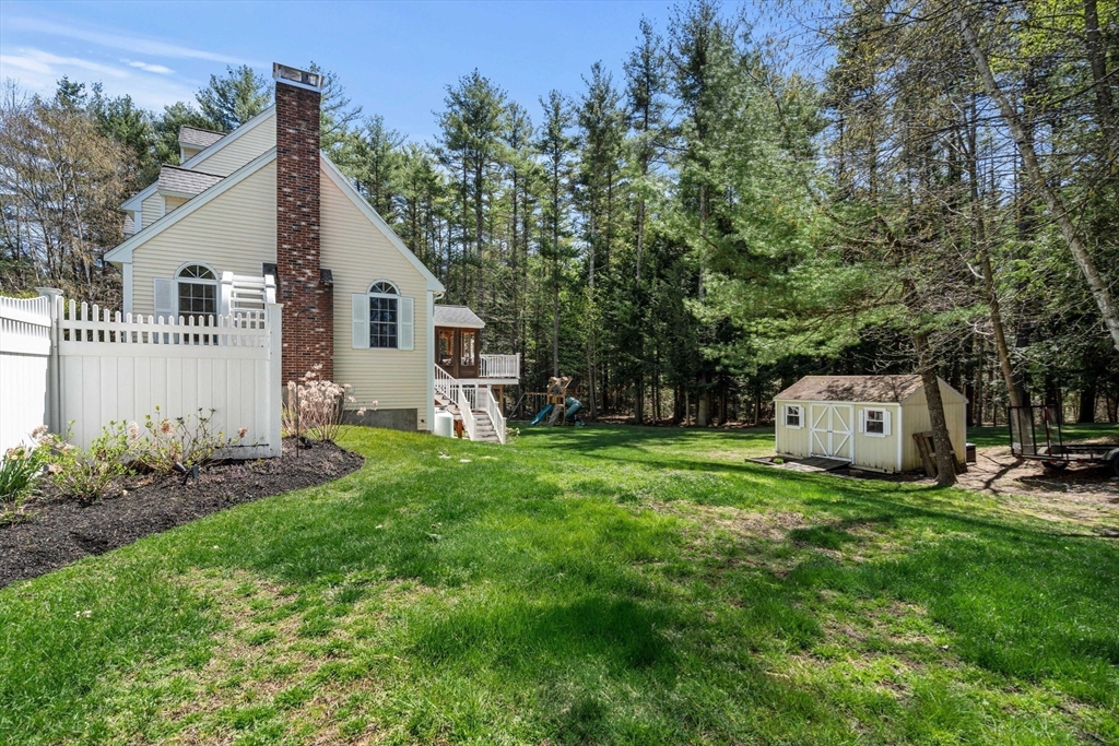 19 Powhatan Road Pepperell, MA 01463 - Photo 37 of 38 a view of a house with backyard