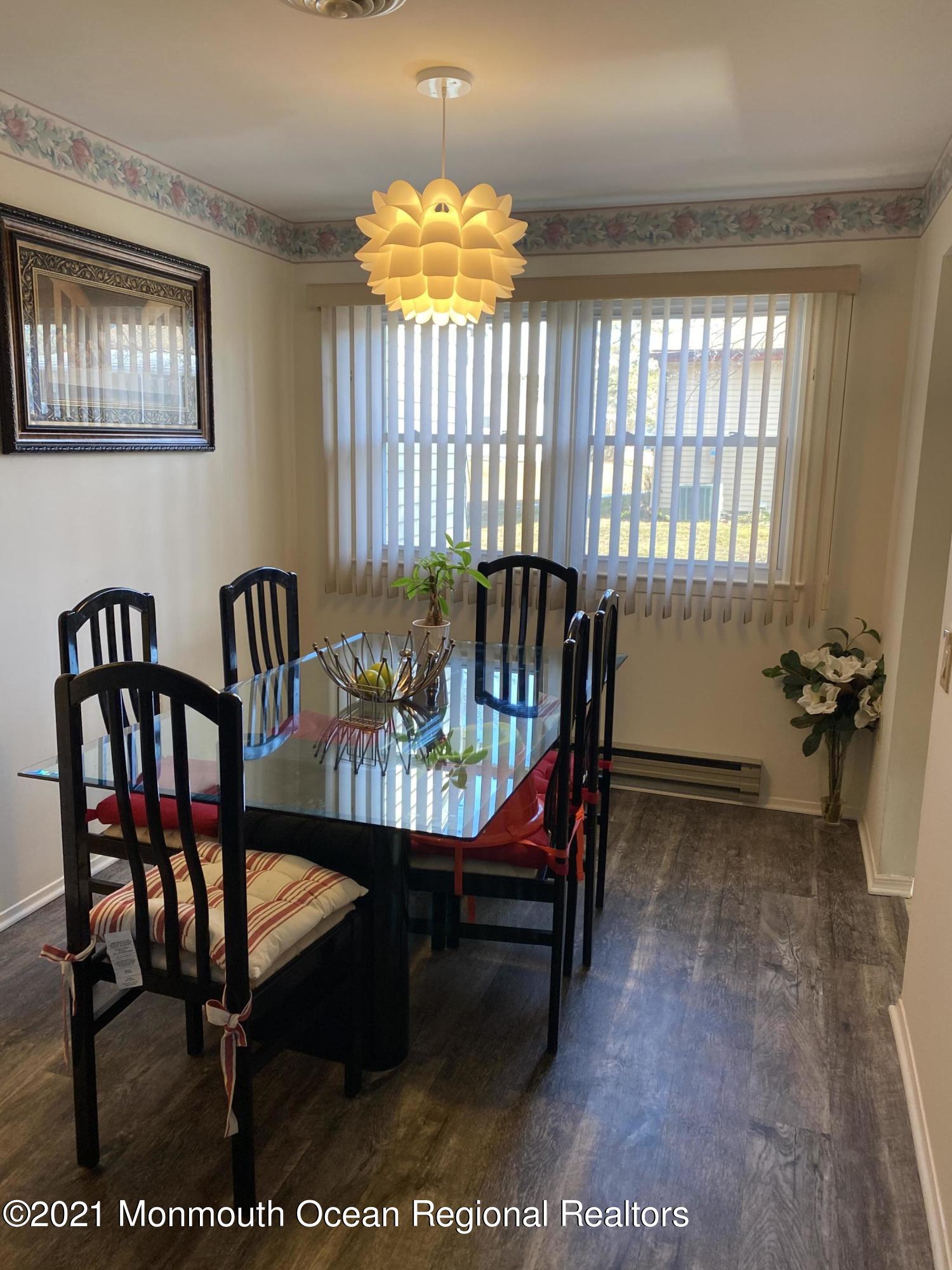 47 Augusta Road, Unit 73 Whiting, NJ 08759 - Photo 3 of 13 a view of a dining room with furniture and window