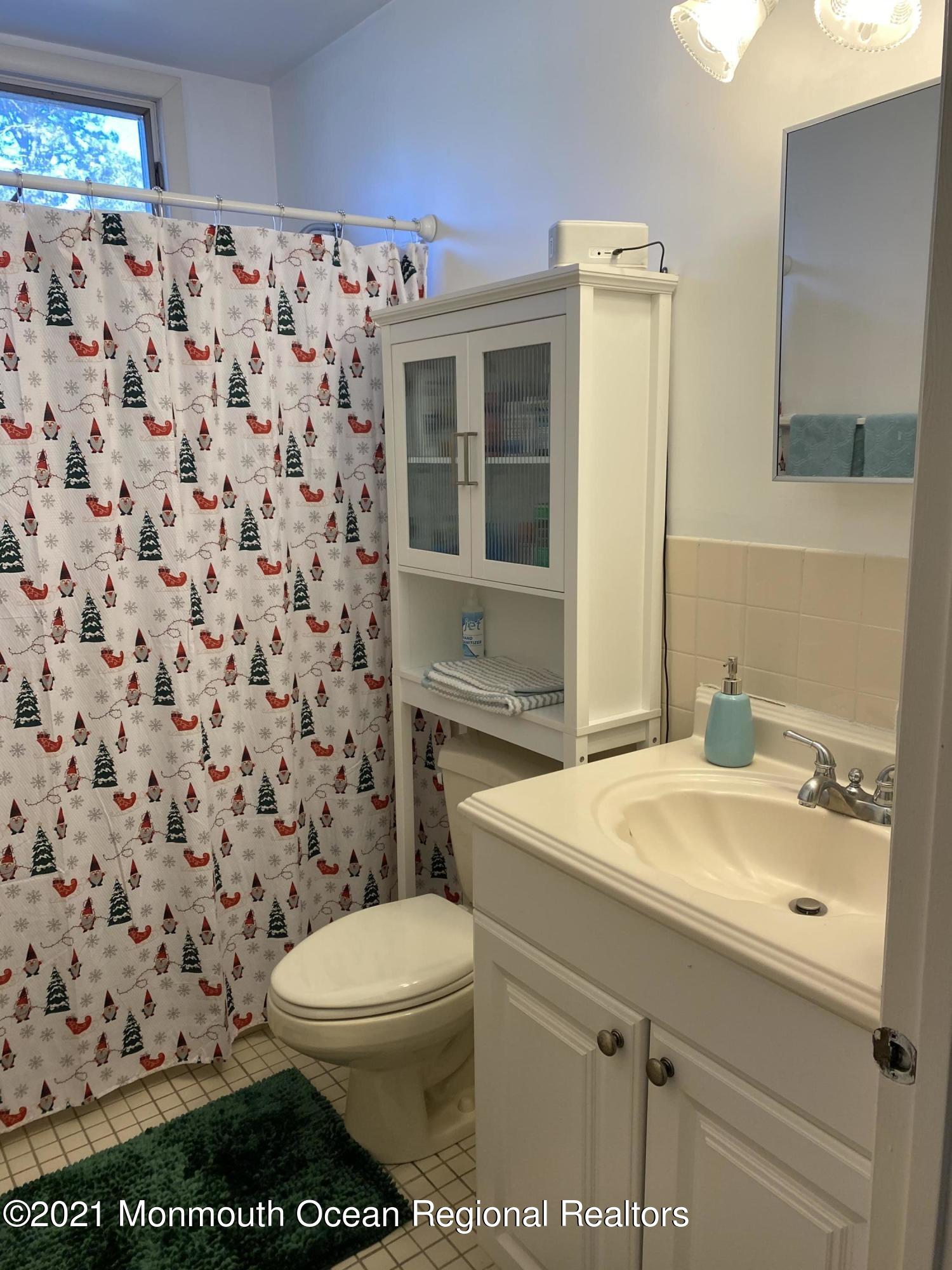 47 Augusta Road, Unit 73 Whiting, NJ 08759 - Photo 7 of 13 a bathroom with a sink toilet and shower
