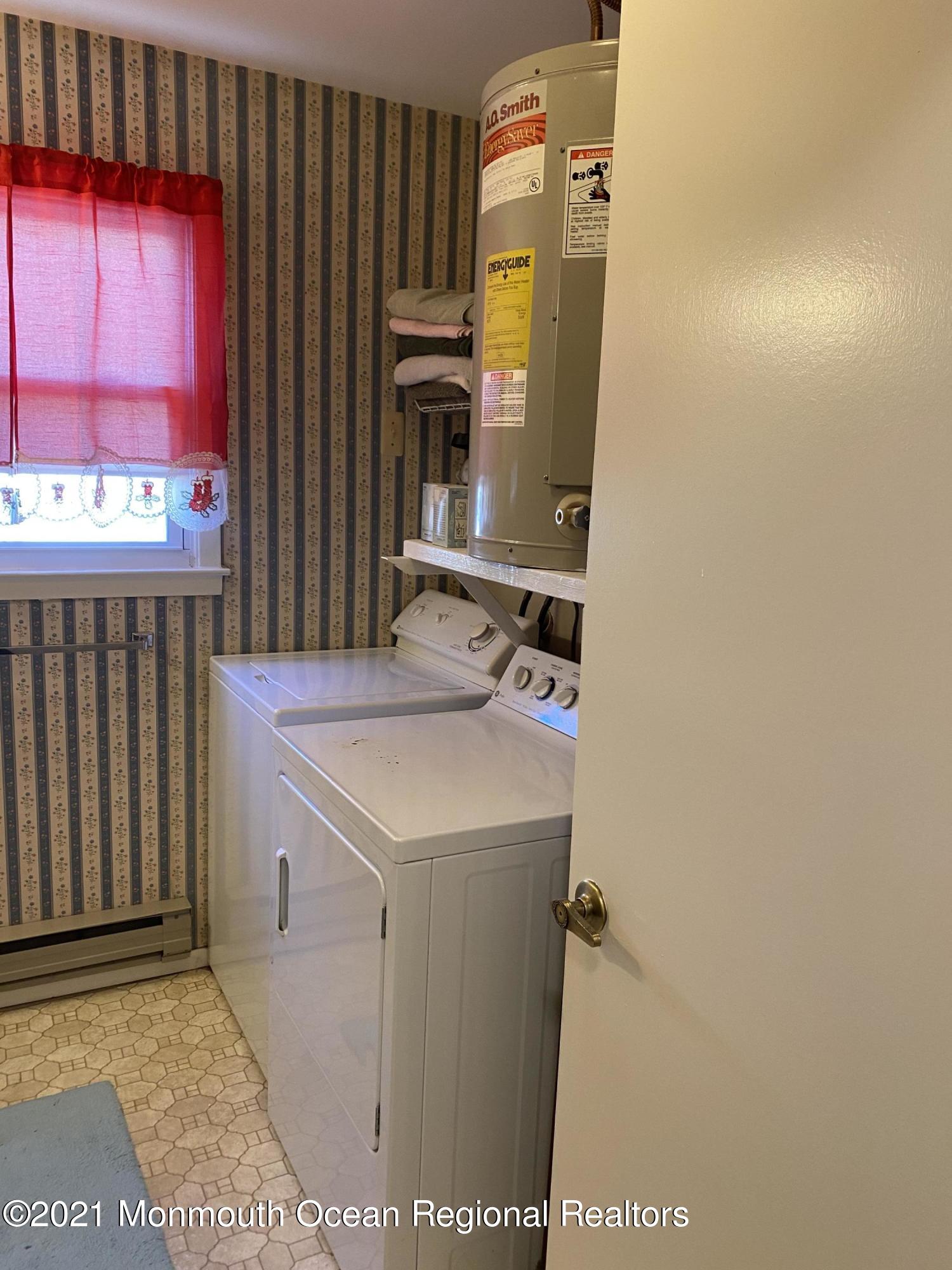 47 Augusta Road, Unit 73 Whiting, NJ 08759 - Photo 9 of 13 a bathroom with a sink and a mirror