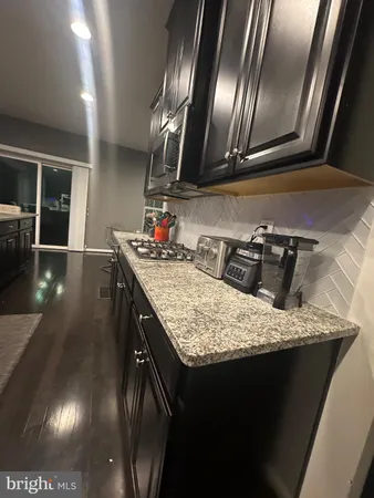 a kitchen with granite countertop lots of counter top space