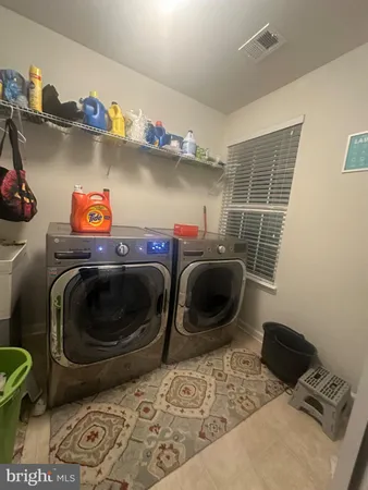 a bedroom with a bed and a mirror