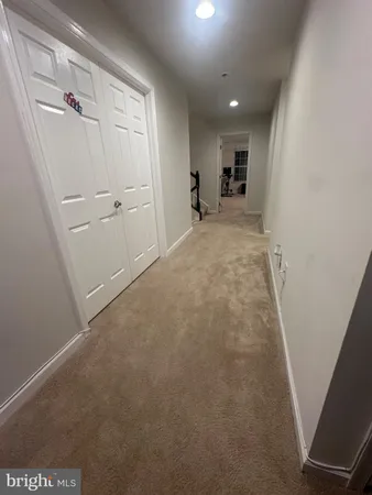 a bedroom with a bed and a television