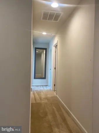 a view of a hallway with stairs