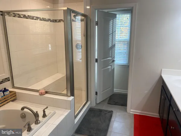 a bedroom with a bed and a mirror