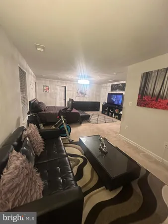 a bed room with furniture and a flat screen tv