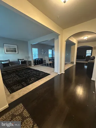 a view of a kitchen counter space and wooden floor