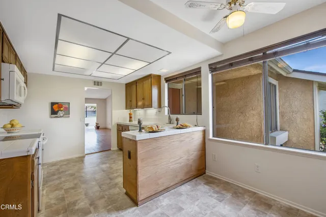 a view of utility room and kitchen