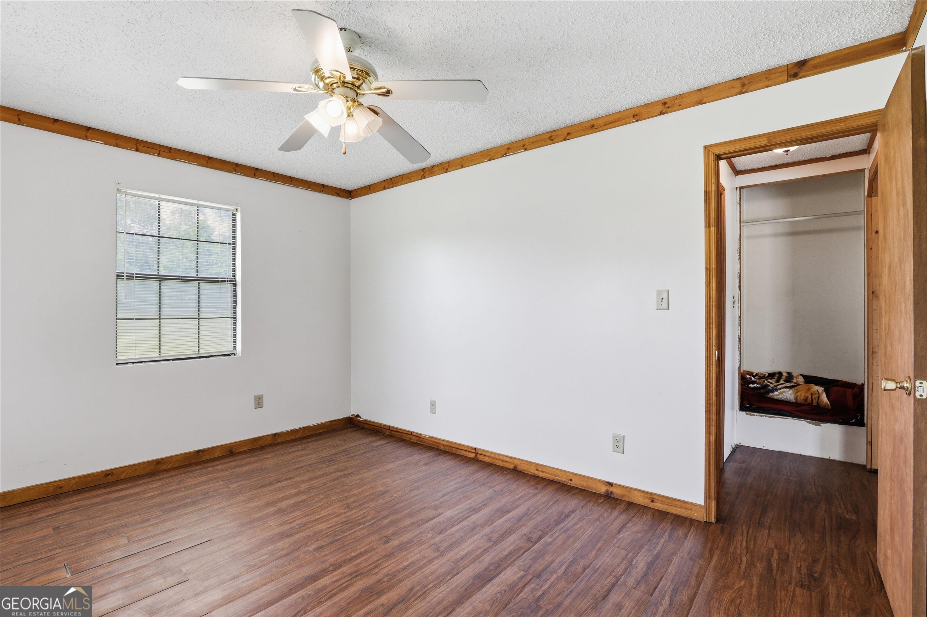 1525 Myron Hart Road Coolidge, GA 31738 - Photo 27 of 58 wooden floor in an empty room with a window