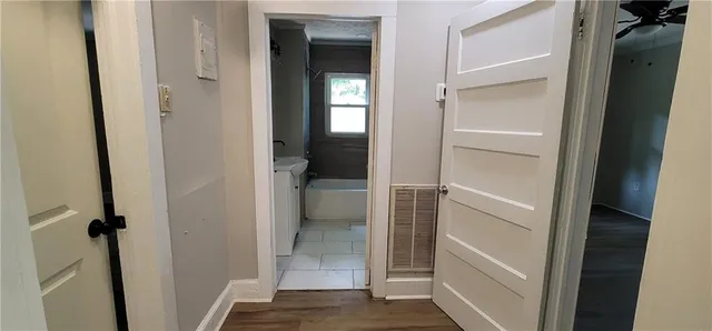 a bathroom with a glass door shower and toilet