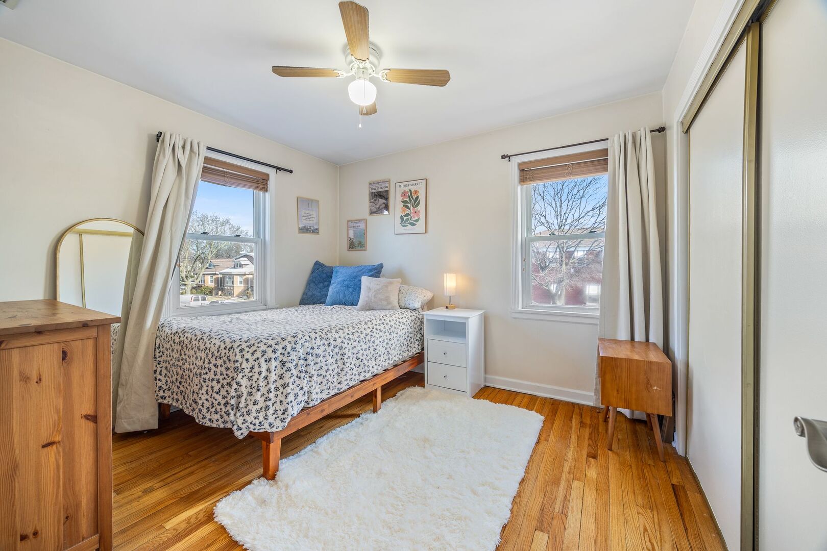 5300 West Foster Avenue Chicago, IL 60630 - Photo 13 of 27 a bedroom with a bed and wooden floor