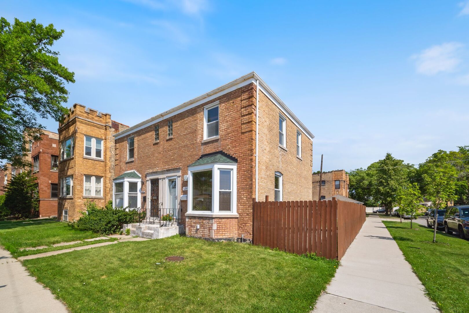 5300 West Foster Avenue Chicago, IL 60630 - Photo 2 of 27 a front view of a house with a yard