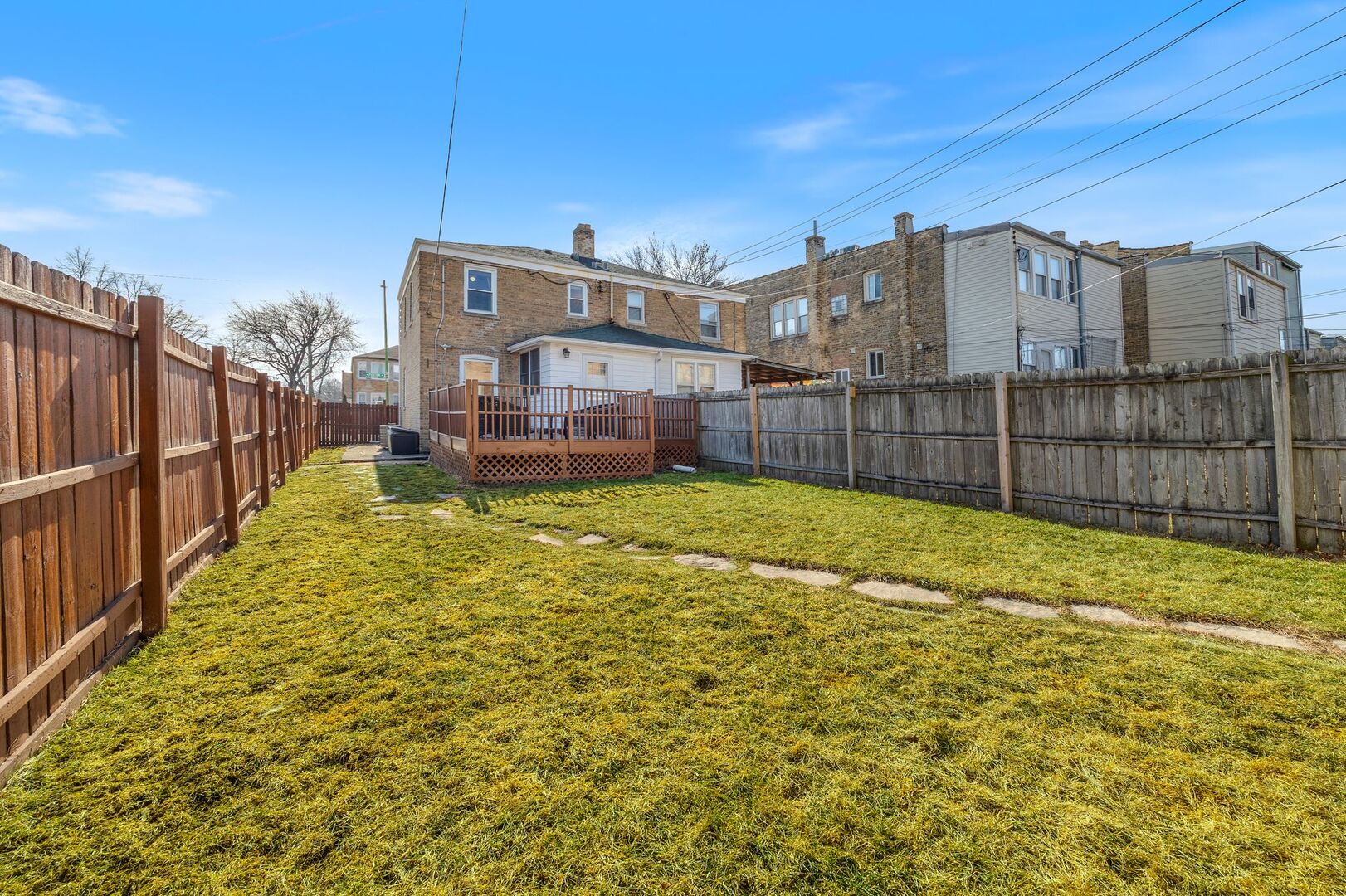 5300 West Foster Avenue Chicago, IL 60630 - Photo 22 of 27 a view of a house with a yard and sitting area