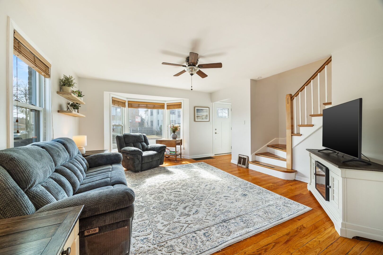 5300 West Foster Avenue Chicago, IL 60630 - Photo 3 of 27 a living room with furniture and a flat screen tv