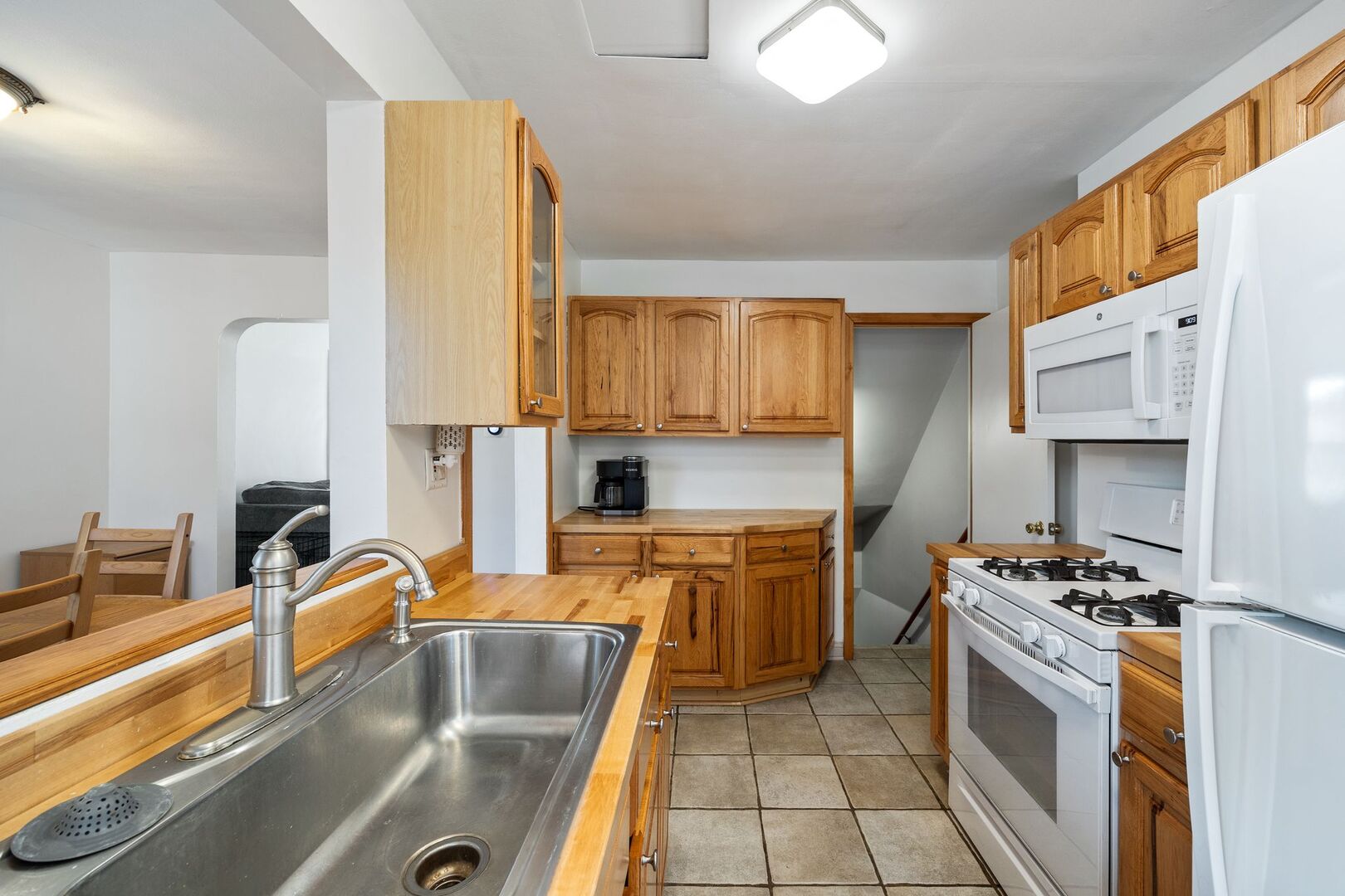 5300 West Foster Avenue Chicago, IL 60630 - Photo 9 of 27 a kitchen with stainless steel appliances granite countertop a sink stove and refrigerator