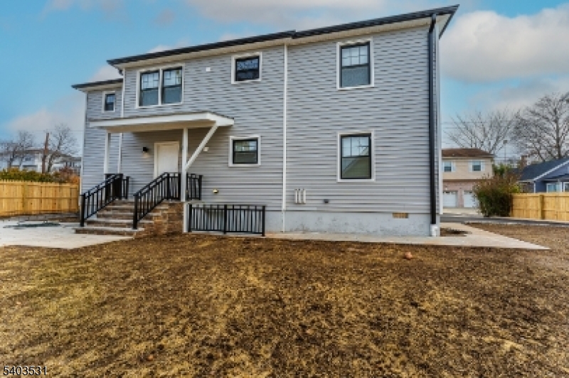 306 Carnegie Place Union, NJ 07088 - Photo 21 of 23 a front view of a house with a yard