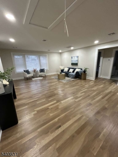 306 Carnegie Place Union, NJ 07088 - Photo 6 of 23 a large room with lots of furniture and a chandelier