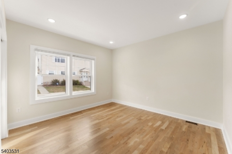 306 Carnegie Place Union, NJ 07088 - Photo 10 of 23 a view of an empty room with a window
