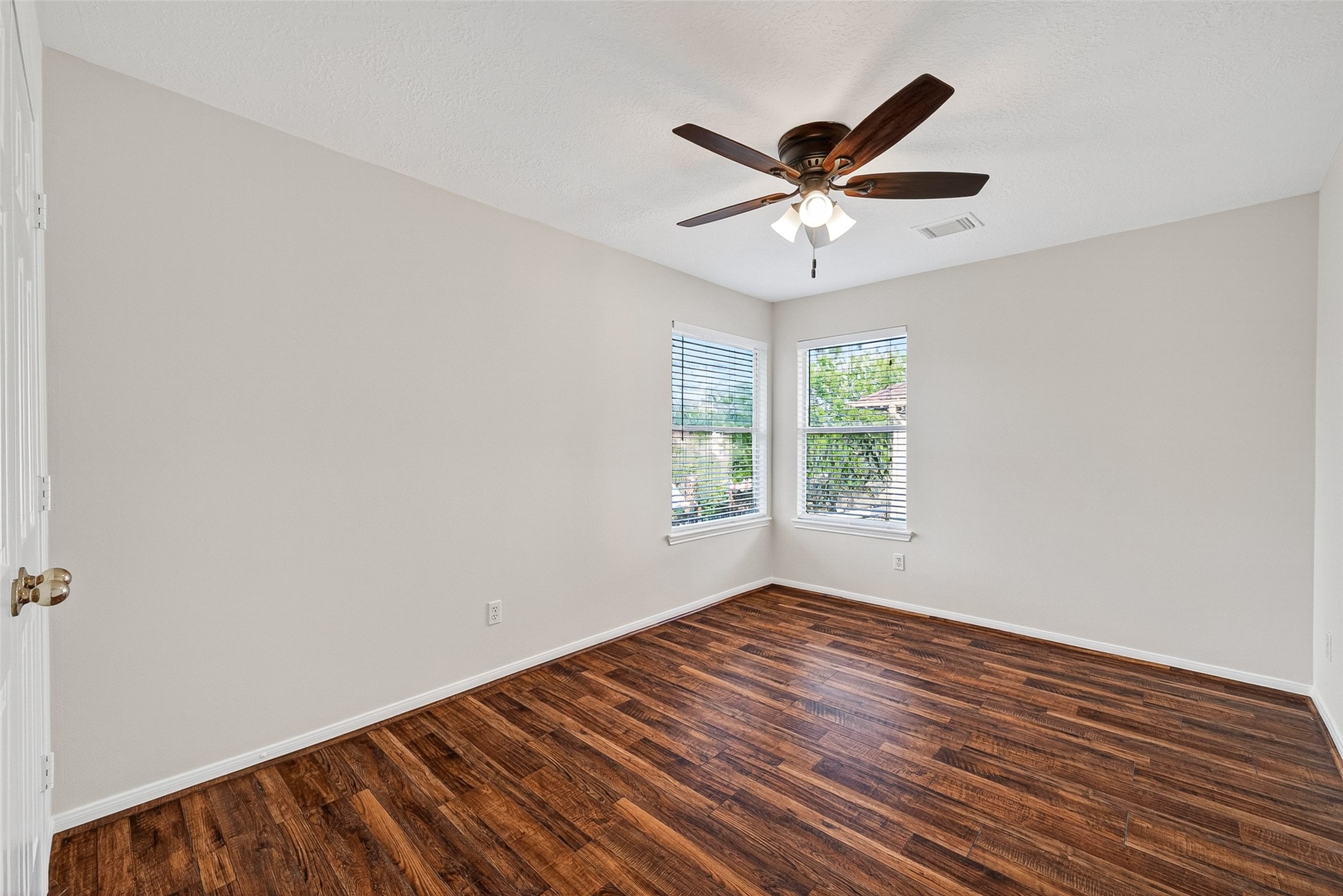 4539 Springfield Lakes Street Sugar Land, TX 77479 - Photo 19 of 34 a view of empty room with wooden floor and fan