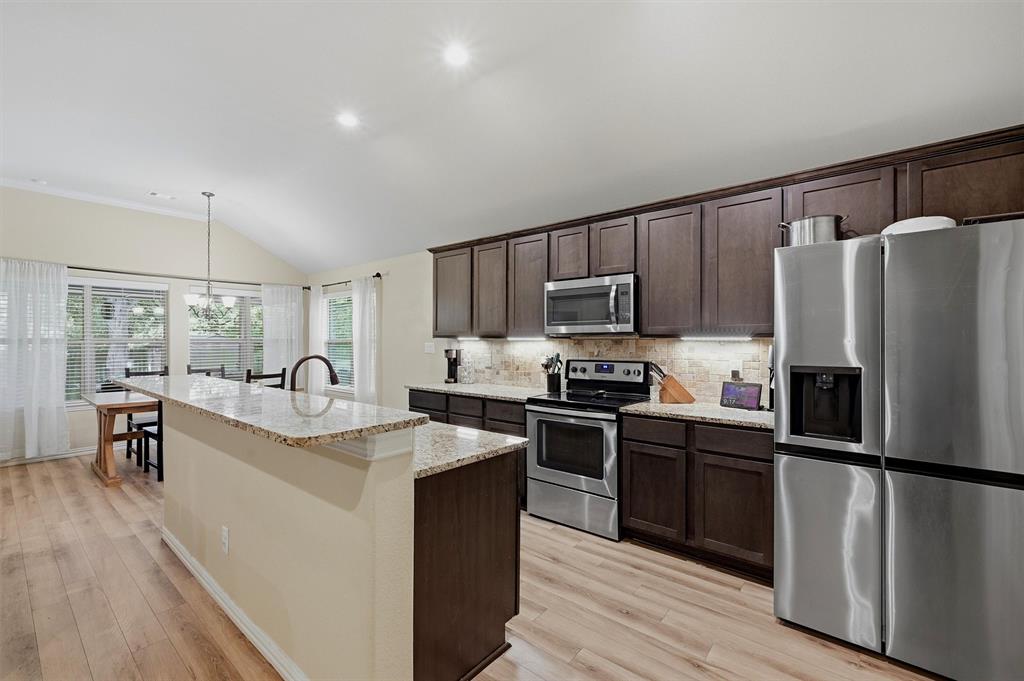 3020 West Loy Lake Road Denison, TX 75020 - Photo 10 of 32 Look at those granite countertops and the backsplash.