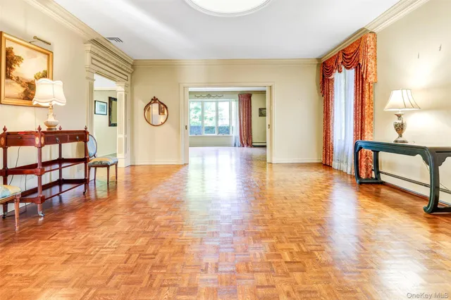 a living room with furniture a rug and a window