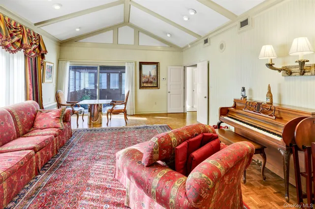 a view of living room with furniture and a fireplace