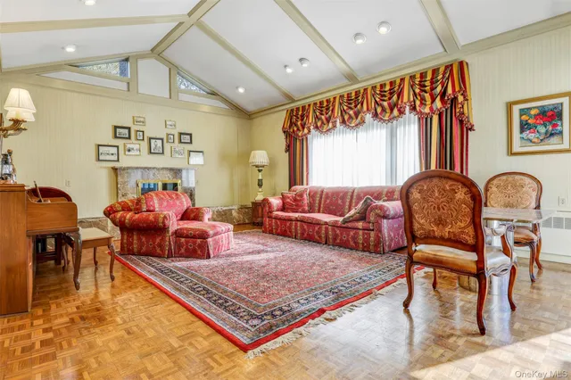 a view of a dining room with furniture and chandelier