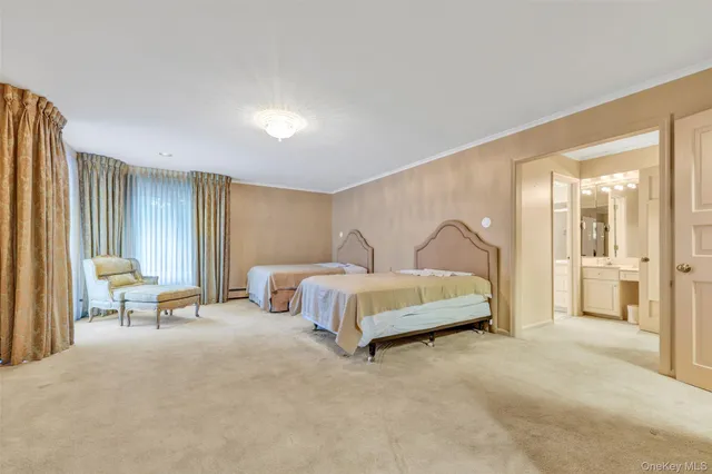 a spacious bathroom with sinks mirror and bathtub