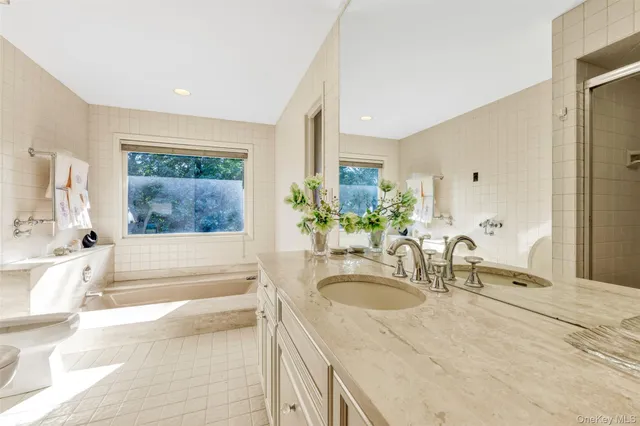a white toilet sitting next to a bath tub