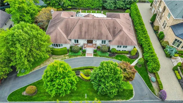an aerial view of a house with yard swimming pool and outdoor seating