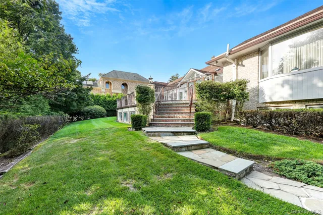 a view of a house with a tree and fence