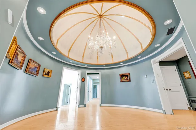 a view of a livingroom with furniture and an entryway
