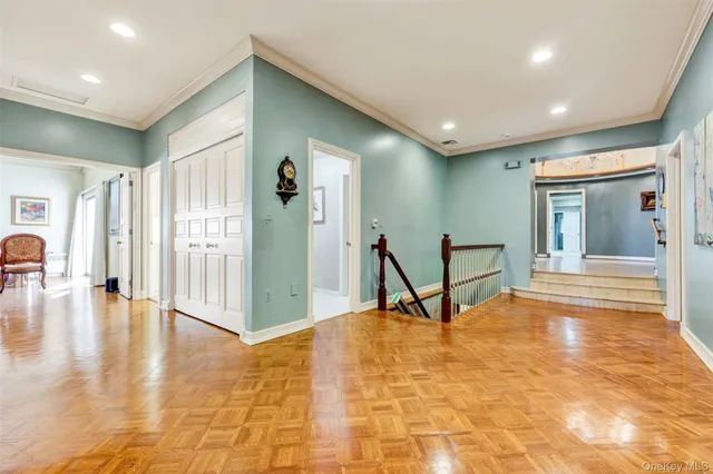 a furnished livingroom with a window and a table