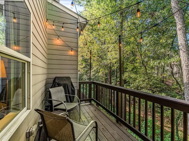 a view of a balcony with chairs