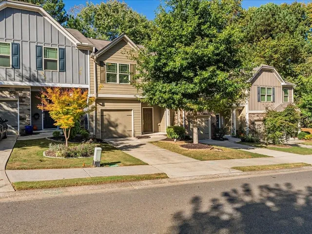 a view of a house with outdoor space and garden