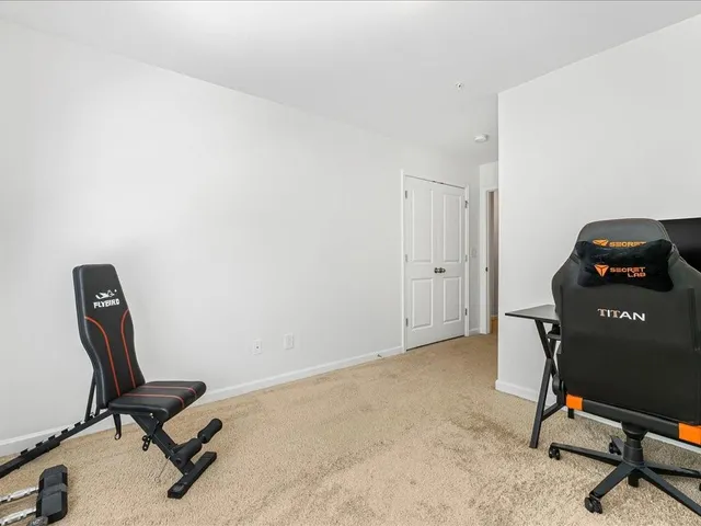 a view of a workspace with furniture