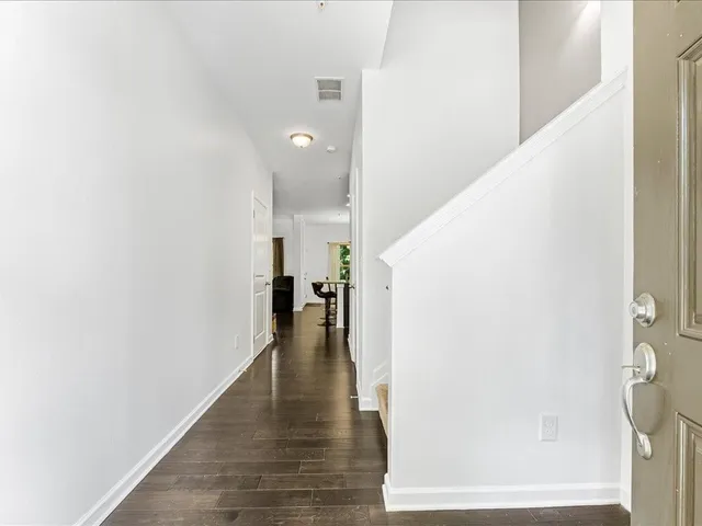 a view of a hallway with the wooden floor