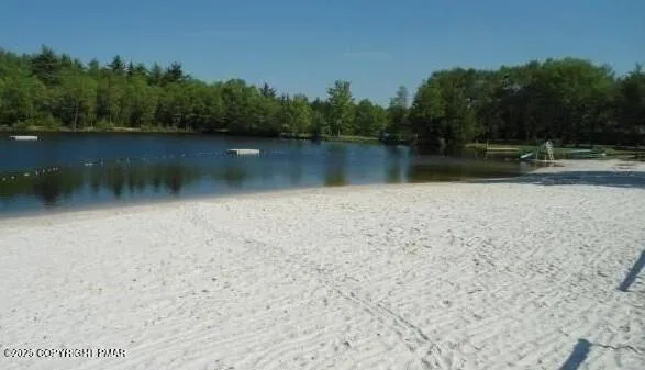 a view of lake with green space