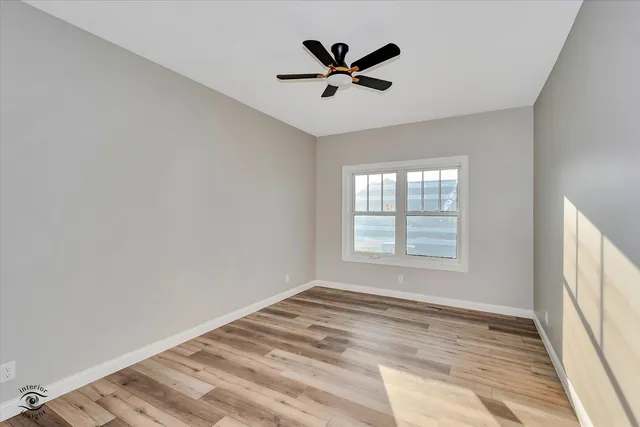 a view of a livingroom with wooden floor