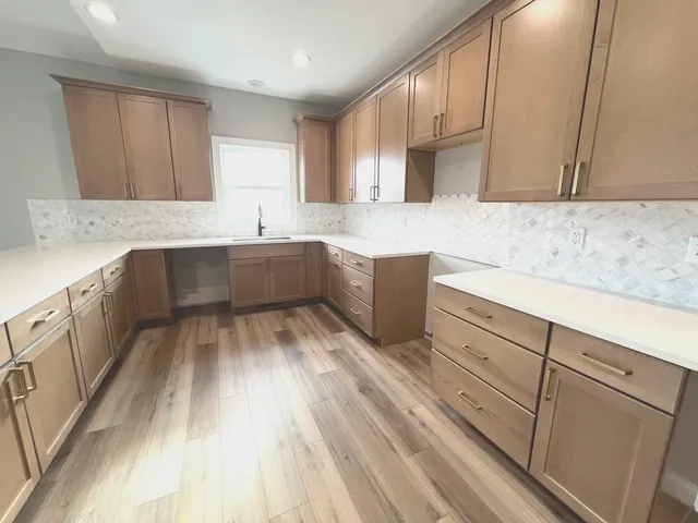 a kitchen with a sink and cabinets