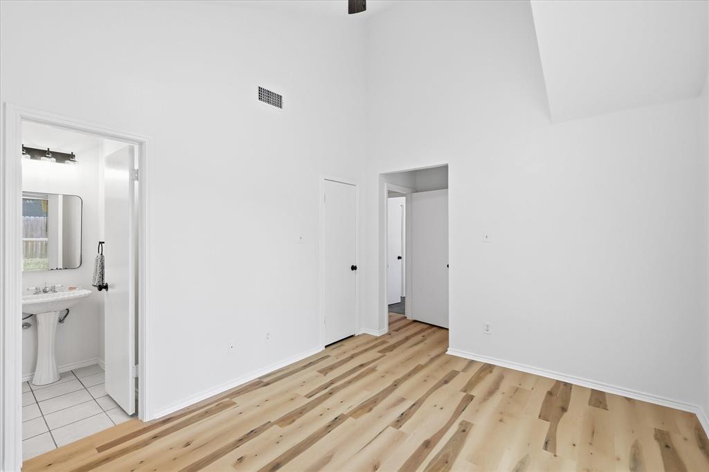 209 Rodeo Drive Keller, TX 76248 - Photo 12 of 26 Vaulted ceiling interior with wood-finish flooring