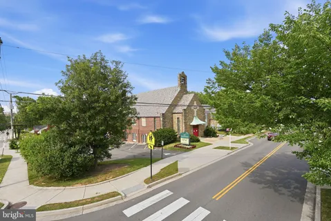 a view of a house with a street
