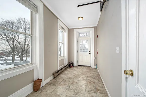 a view of a hallway with windows