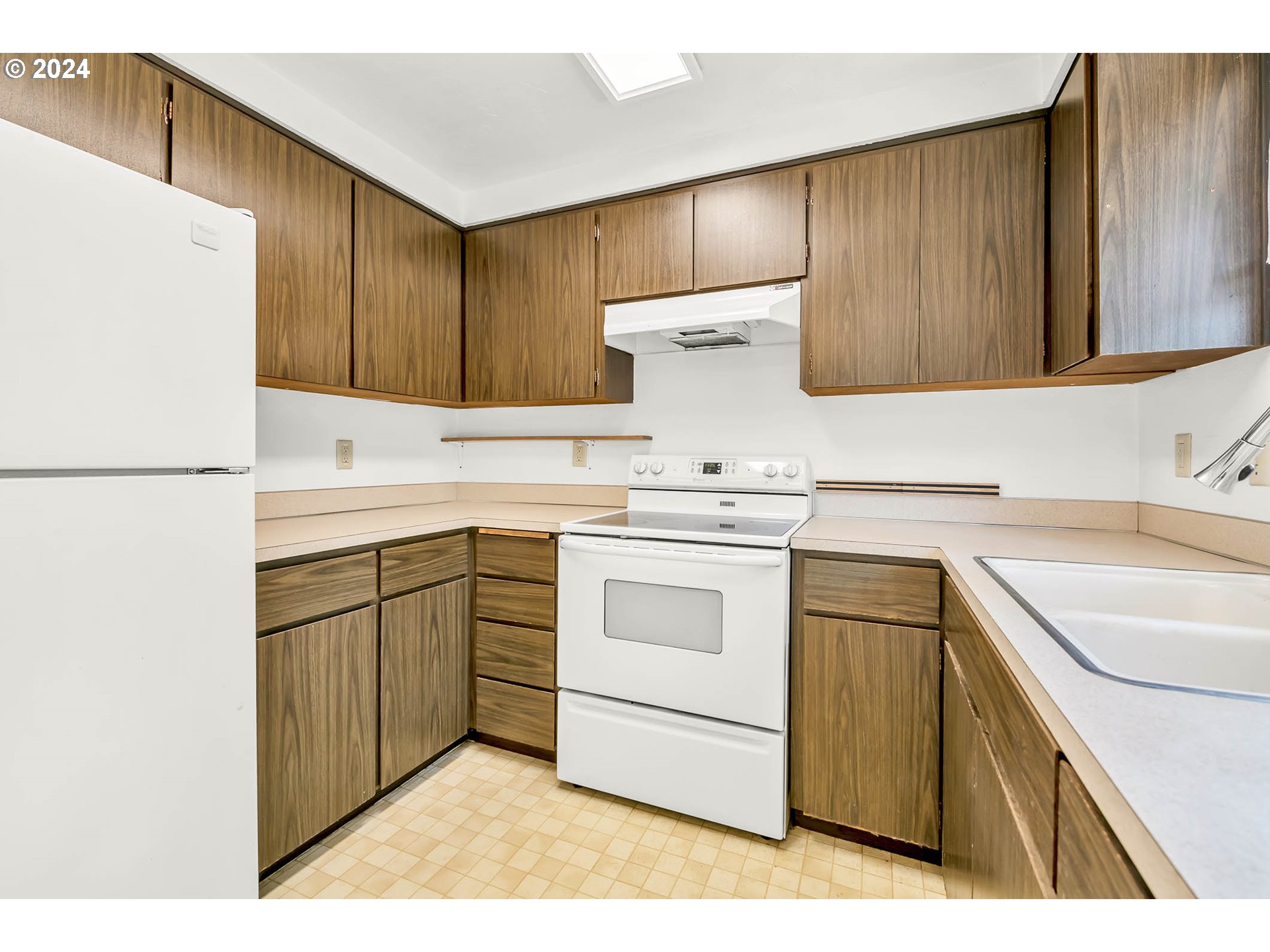 6112 Main Street Springfield, OR 97478 - Photo 12 of 47 a kitchen with a sink a stove a refrigerator and a cabinets