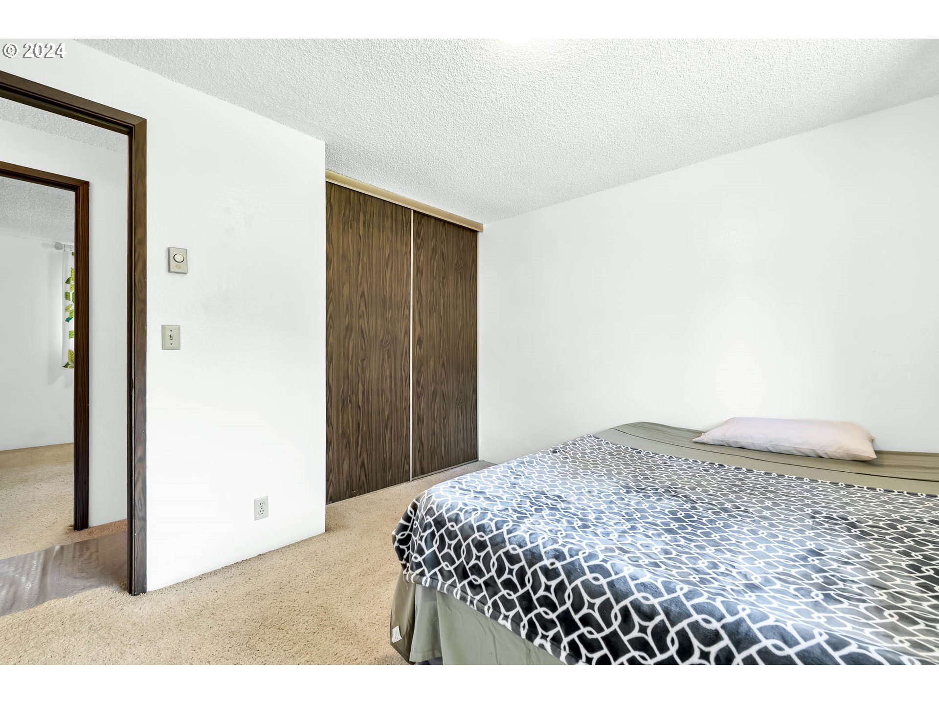 6112 Main Street Springfield, OR 97478 - Photo 15 of 47 a bedroom with a bed and a view of wooden floor