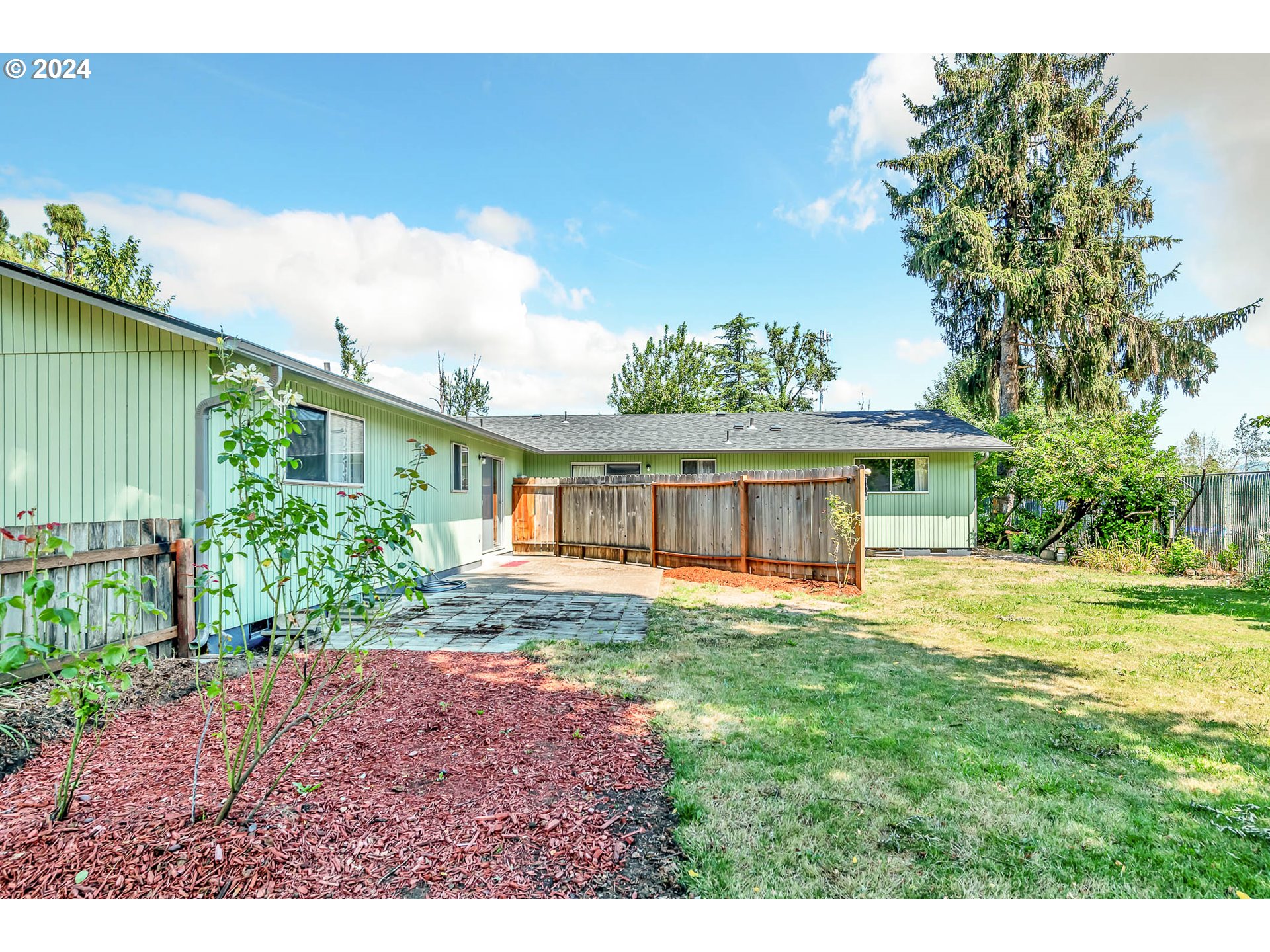 6112 Main Street Springfield, OR 97478 - Photo 23 of 47 a front view of a house with a yard