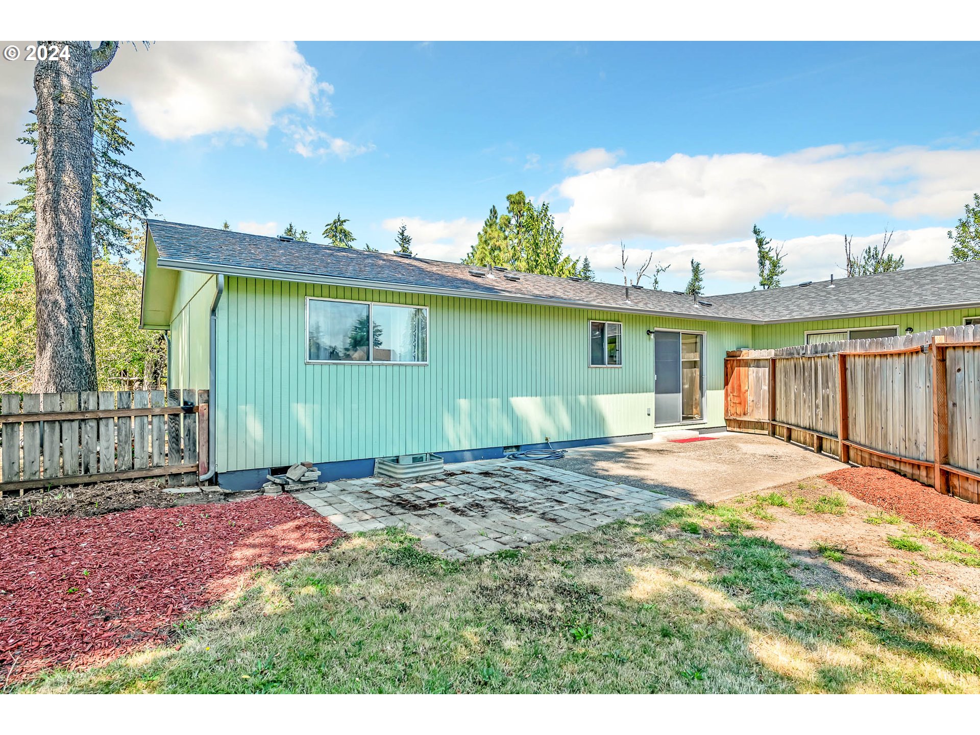6112 Main Street Springfield, OR 97478 - Photo 24 of 47 a front view of a house with a yard