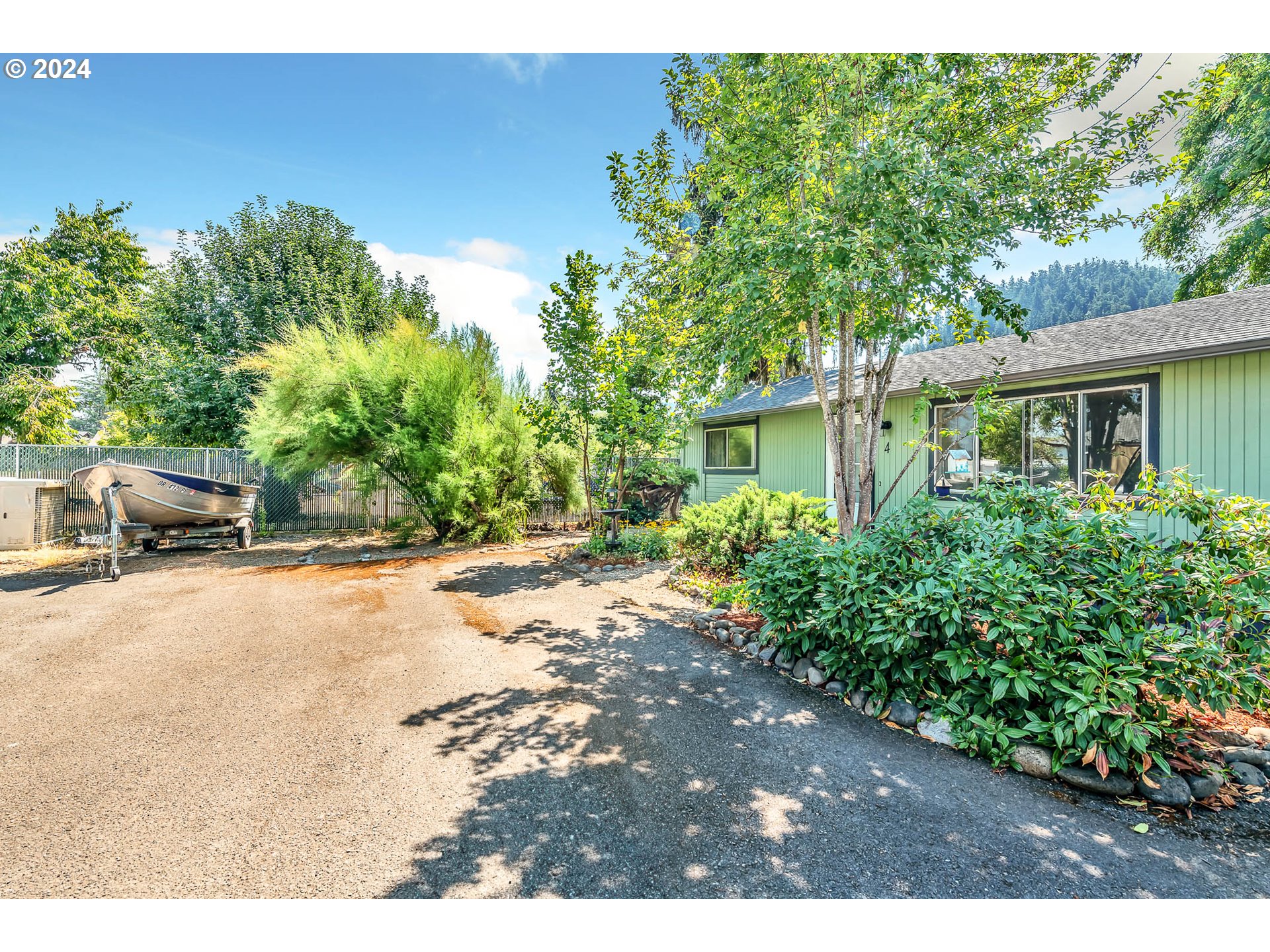 6112 Main Street Springfield, OR 97478 - Photo 28 of 47 a view of a backyard of a house