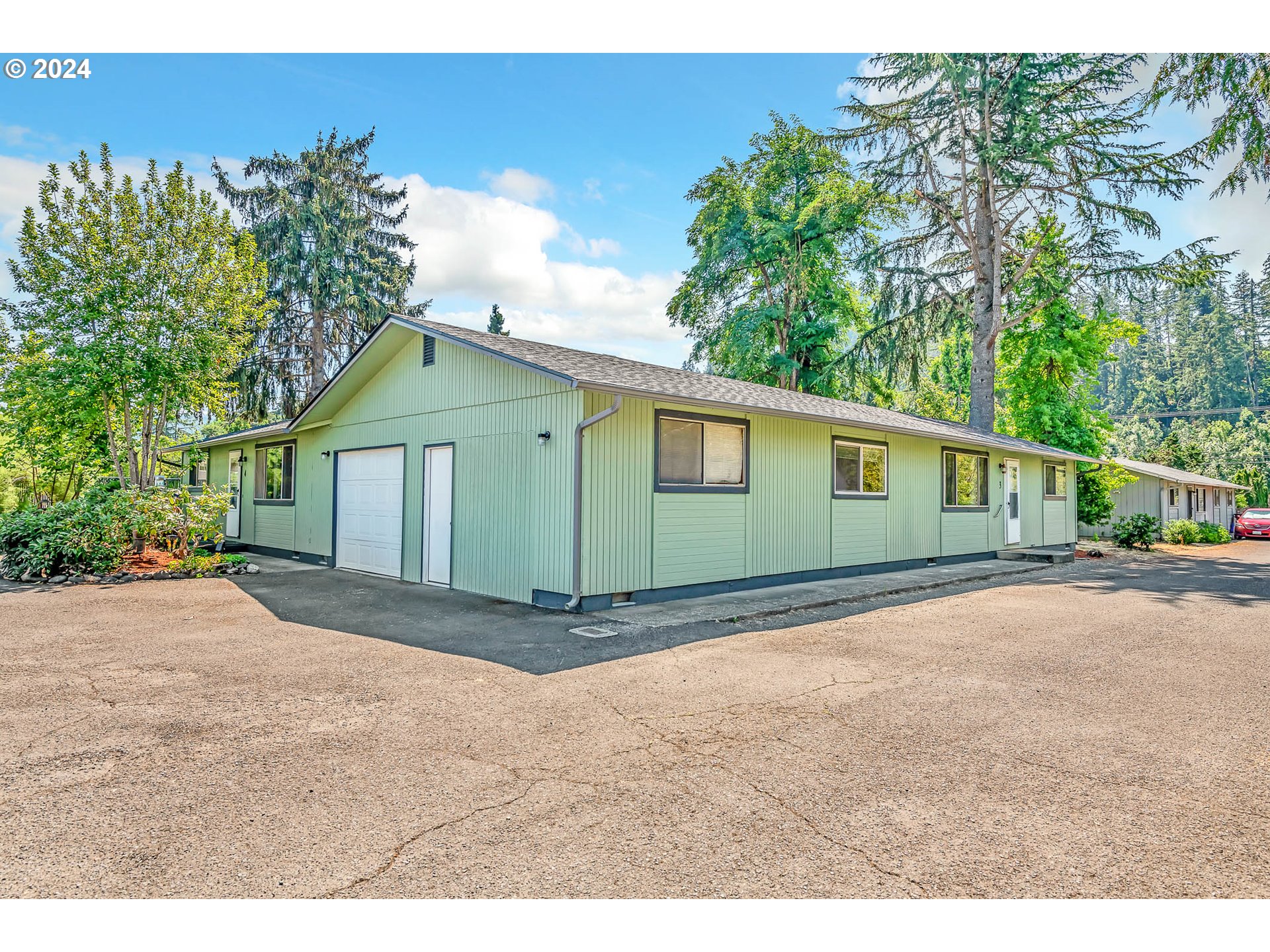 6112 Main Street Springfield, OR 97478 - Photo 3 of 47 a view of a house with a yard